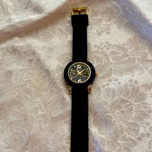 Bora watch. Black with gold and silver accents.  Rubber strap. Good condition.